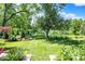 Landscaped backyard with pond and lush greenery at 635 Terrace Dr, Zionsville, IN 46077