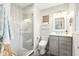 Updated bathroom with a walk-in shower and modern vanity at 635 Terrace Dr, Zionsville, IN 46077