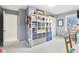 Cozy bedroom featuring built-in shelving and ample closet space at 635 Terrace Dr, Zionsville, IN 46077