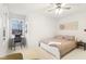 Bright bedroom with a queen bed, workspace, and window seat at 635 Terrace Dr, Zionsville, IN 46077