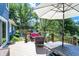 Deck with patio furniture and umbrella overlooking pond at 635 Terrace Dr, Zionsville, IN 46077