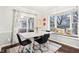 Bright dining room with a built-in window seat and access to a deck at 635 Terrace Dr, Zionsville, IN 46077