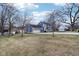 Blue house with attached garage and a large yard, pond view at 635 Terrace Dr, Zionsville, IN 46077