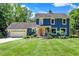 Stunning two-story home with a white garage door and landscaped yard at 635 Terrace Dr, Zionsville, IN 46077