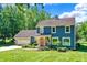 Two-story blue house with a pink door at 635 Terrace Dr, Zionsville, IN 46077