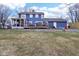 House exterior showcasing a large deck and stone retaining wall at 635 Terrace Dr, Zionsville, IN 46077