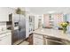 Spacious kitchen with stainless steel appliances and breakfast bar at 635 Terrace Dr, Zionsville, IN 46077