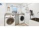 Laundry room with washer, dryer, and utility sink at 635 Terrace Dr, Zionsville, IN 46077