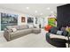 Spacious living room featuring a comfortable sectional sofa and a modern fireplace at 635 Terrace Dr, Zionsville, IN 46077
