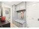 Mudroom with built-in bench seating and storage at 635 Terrace Dr, Zionsville, IN 46077