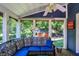 Cozy screened porch with seating and a ceiling fan at 635 Terrace Dr, Zionsville, IN 46077