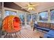 Relaxing screened porch with wicker furniture at 635 Terrace Dr, Zionsville, IN 46077
