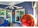 Screened porch with wicker furniture and pond view at 635 Terrace Dr, Zionsville, IN 46077