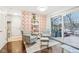 Bright sunroom with comfy seating and deck access at 635 Terrace Dr, Zionsville, IN 46077