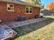 Side yard with gravel and partial patio at 658 Mellowood Dr, Indianapolis, IN 46217