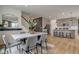 Dining room with marble table, gray chairs, and a view of the kitchen at 6957 Hornbeam Cir, Brownsburg, IN 46112