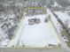 Aerial view showing house and large lot in snowy landscape at 8662 N Kitchen Rd, Mooresville, IN 46158