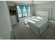 Main bedroom with king-size bed, window, and updated decor at 8836 Hornady Ct, Indianapolis, IN 46239