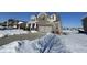 Two story home with attached garage, partially covered in snow at 8836 Hornady Ct, Indianapolis, IN 46239