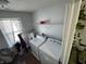 Laundry room with washer, dryer, and shelving at 8836 Hornady Ct, Indianapolis, IN 46239