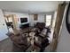 Open concept living room with brown sectional and hardwood floors at 8836 Hornady Ct, Indianapolis, IN 46239
