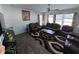 Large living room with brown leather sectional and hardwood floors at 8836 Hornady Ct, Indianapolis, IN 46239