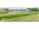 Peaceful pond view with lush green landscaping at 8836 Hornady Ct, Indianapolis, IN 46239