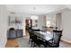 Dining area with dark wood table, six chairs, and hardwood floors at 9502 Helmsdale Dr, Indianapolis, IN 46256