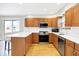 Modern kitchen with u-shaped island and stainless steel appliances at 9502 Helmsdale Dr, Indianapolis, IN 46256