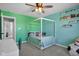 Charming bedroom with a four-poster bed and colorful decor at 9843 Mosaic Blue Way, Indianapolis, IN 46239