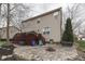 Backyard featuring a patio, fire pit, and stairs leading to a deck, ideal for outdoor enjoyment at 10402 Shakamak Way, Indianapolis, IN 46239