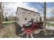 Backyard with deck, hot tub, and stepping stones, set in a tranquil, tree-lined landscape at 10402 Shakamak Way, Indianapolis, IN 46239