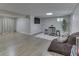 Finished basement with hardwood floors and a TV at 10402 Shakamak Way, Indianapolis, IN 46239