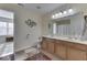 Shared bathroom with double vanity and a large mirror at 10402 Shakamak Way, Indianapolis, IN 46239
