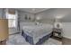 Spacious bedroom with a queen-size bed and hardwood floors at 10402 Shakamak Way, Indianapolis, IN 46239