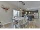 Farmhouse style dining room with view into the kitchen at 10402 Shakamak Way, Indianapolis, IN 46239