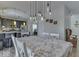 Dining area with rustic chandelier and view of kitchen at 10402 Shakamak Way, Indianapolis, IN 46239