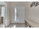 Bright and airy entryway with shoe storage bench at 10402 Shakamak Way, Indianapolis, IN 46239