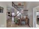 Grand two-story entryway with hardwood floors and a wooden staircase at 10402 Shakamak Way, Indianapolis, IN 46239