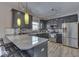 Modern kitchen with dark cabinetry and stainless steel appliances at 10402 Shakamak Way, Indianapolis, IN 46239