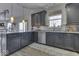 Modern kitchen with dark cabinetry and island at 10402 Shakamak Way, Indianapolis, IN 46239