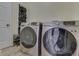 Convenient laundry room with a washer and dryer, and shoe storage at 10402 Shakamak Way, Indianapolis, IN 46239