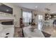 Open living room with fireplace and adjacent dining area at 10402 Shakamak Way, Indianapolis, IN 46239