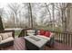Spacious deck with comfortable seating, offering views of a lush backyard with pool and mature trees at 10402 Shakamak Way, Indianapolis, IN 46239