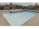 Community pool with lounge chairs and pool house for relaxation and shade at 10402 Shakamak Way, Indianapolis, IN 46239