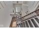 Elegant staircase with dark wood railings and tiled entryway at 10402 Shakamak Way, Indianapolis, IN 46239