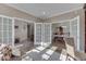 Sunroom with French doors opening to entryway and dining room at 10402 Shakamak Way, Indianapolis, IN 46239