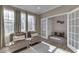 Bright sunroom with two comfy chairs and lots of natural light at 10402 Shakamak Way, Indianapolis, IN 46239