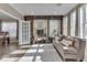 Sunroom with built-in shelving and comfortable seating at 10402 Shakamak Way, Indianapolis, IN 46239