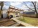 Landscaped backyard with patio, pergola, and garden beds, offering a serene outdoor space at 1102 N Newman St, Indianapolis, IN 46201